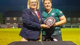 Photo of Captain Amie receiving our first trophy